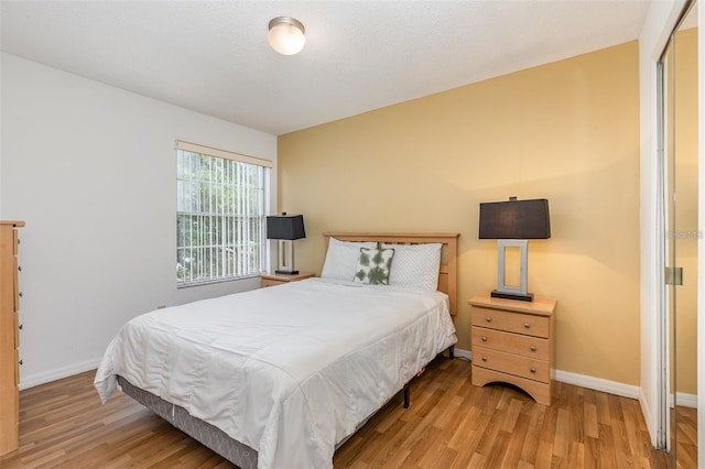 bedroom with wood finished floors