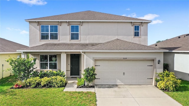 9024 Alba Ln, Kissimmee, FL 34747 - traditional-style house with stucco siding, concrete driveway, and a garage