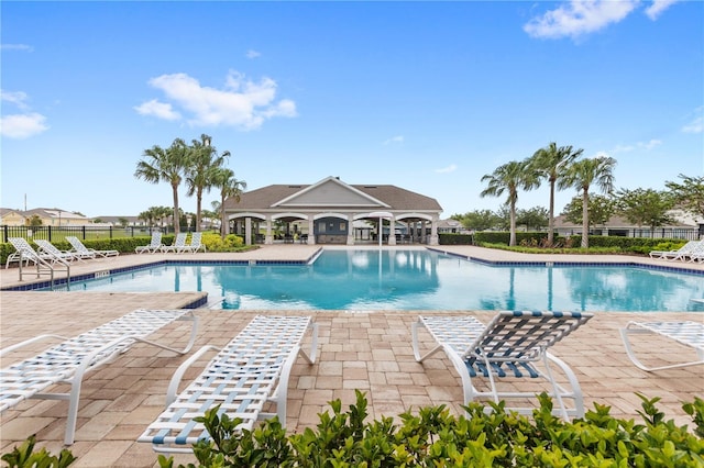 9024 Alba Ln, Kissimmee, FL 34747 - community pool featuring a patio area
