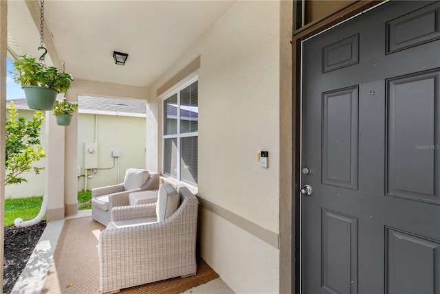 9024 Alba Ln, Kissimmee, FL 34747 - doorway to property featuring stucco siding and covered porch