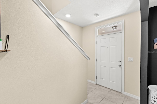 9024 Alba Ln, Kissimmee, FL 34747 - foyer entrance featuring light tile patterned floors and baseboards