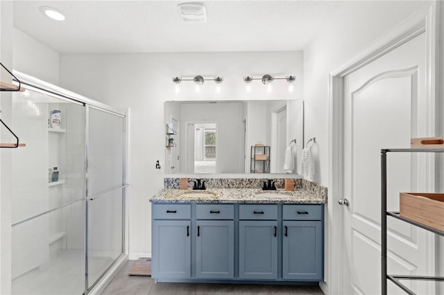 9024 Alba Ln, Kissimmee, FL 34747 - bathroom with a shower stall and double vanity