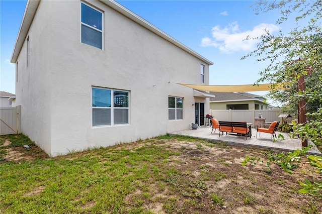 9024 Alba Ln, Kissimmee, FL 34747 - rear view of house featuring a patio, a fenced backyard, an outdoor living space, and stucco siding