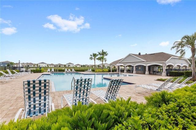 9024 Alba Ln, Kissimmee, FL 34747 - community pool featuring a patio area