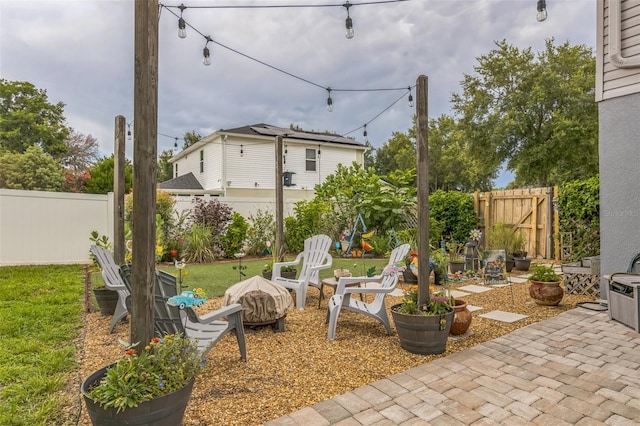 2032 Wavyleaf Ct, Apopka, FL 32712 - fenced backyard with a fire pit and a patio area