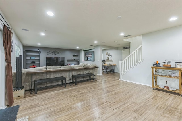 2032 Wavyleaf Ct, Apopka, FL 32712 - living area featuring wood finished floors, stairs, and recessed lighting
