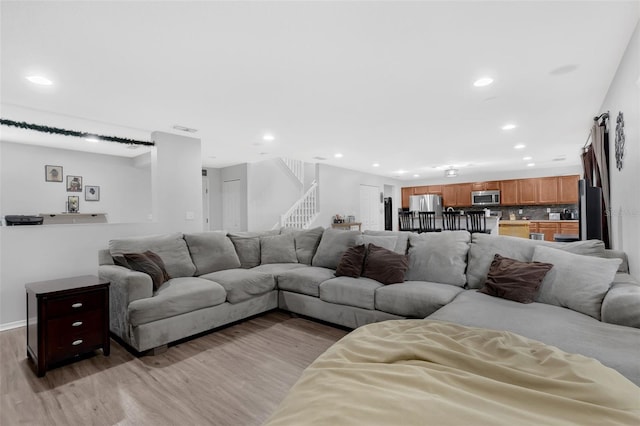 2032 Wavyleaf Ct, Apopka, FL 32712 - living area featuring light wood-style floors, recessed lighting, and stairway