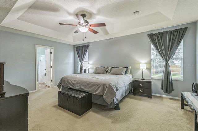 2032 Wavyleaf Ct, Apopka, FL 32712 - bedroom featuring a raised ceiling, light carpet, multiple windows, ceiling fan, and a textured ceiling