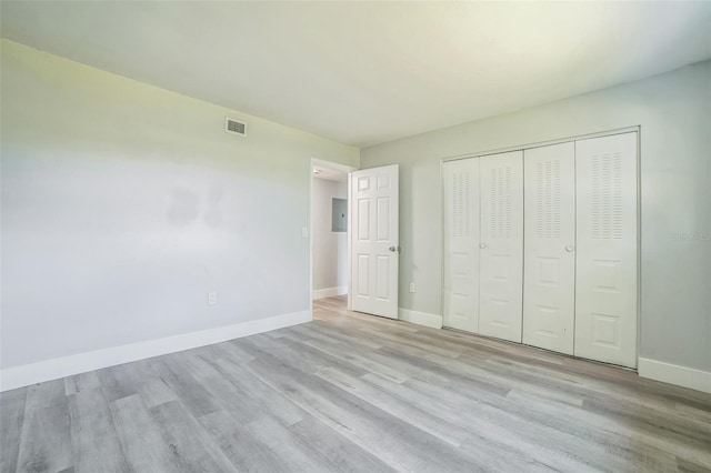 936 Lake Destiny Rd Unit G, Altamonte Springs, FL 32714 - unfurnished bedroom featuring light wood-style floors, a closet, and electric panel