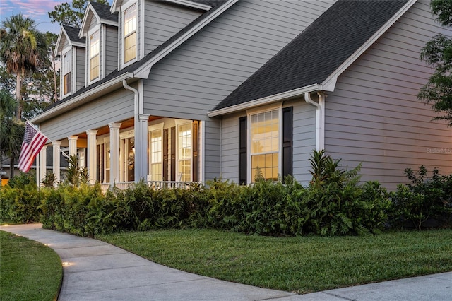 1443 Stone Trl, Enterprise, FL 32725 - view of side of property featuring a lawn and a shingled roof