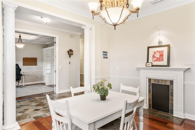 1443 Stone Trl, Enterprise, FL 32725 - dining area with dark wood-style flooring, ornate columns, ornamental molding, and a chandelier