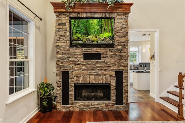 1443 Stone Trl, Enterprise, FL 32725 - detailed view of wood finished floors and a fireplace