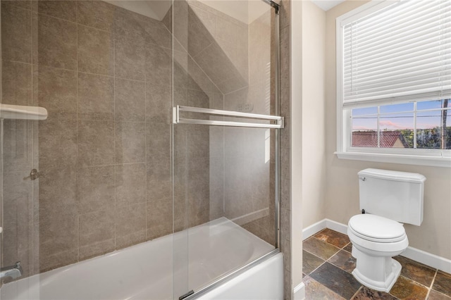 1443 Stone Trl, Enterprise, FL 32725 - bathroom featuring stone tile floors and shower / bath combination with glass door