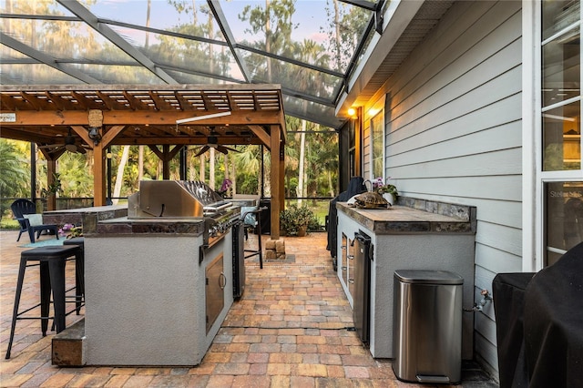 1443 Stone Trl, Enterprise, FL 32725 - view of patio / terrace featuring exterior kitchen and a lanai