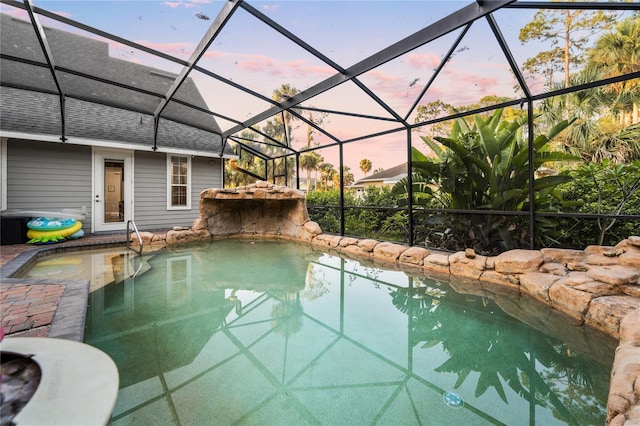 1443 Stone Trl, Enterprise, FL 32725 - pool at dusk with an outdoor pool and glass enclosure