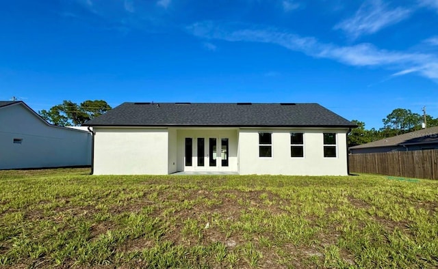 2634 De Groodt Rd SW, Palm Bay, FL 32908 - back of house with french doors and stucco siding