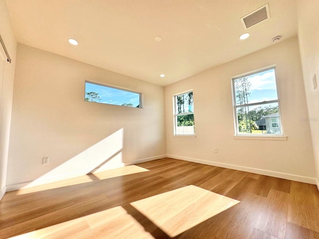 2634 De Groodt Rd SW, Palm Bay, FL 32908 - unfurnished room featuring wood finished floors and recessed lighting