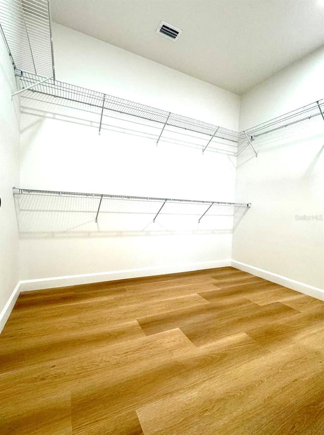 2634 De Groodt Rd SW, Palm Bay, FL 32908 - walk in closet with wood finished floors