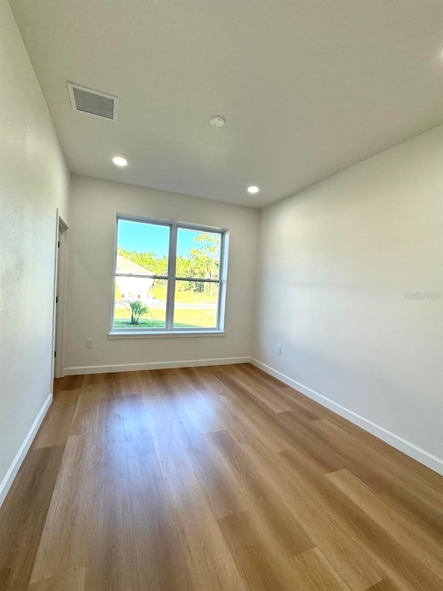 2634 De Groodt Rd SW, Palm Bay, FL 32908 - empty room featuring wood finished floors and recessed lighting