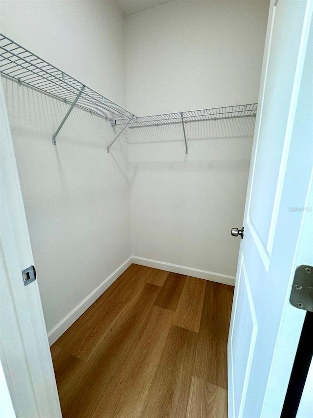 2634 De Groodt Rd SW, Palm Bay, FL 32908 - spacious closet featuring wood finished floors