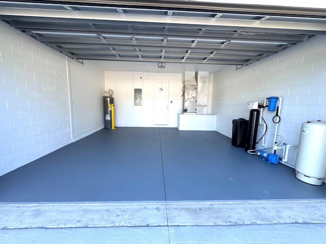 2634 De Groodt Rd SW, Palm Bay, FL 32908 - garage with water heater, heating unit, and electric panel