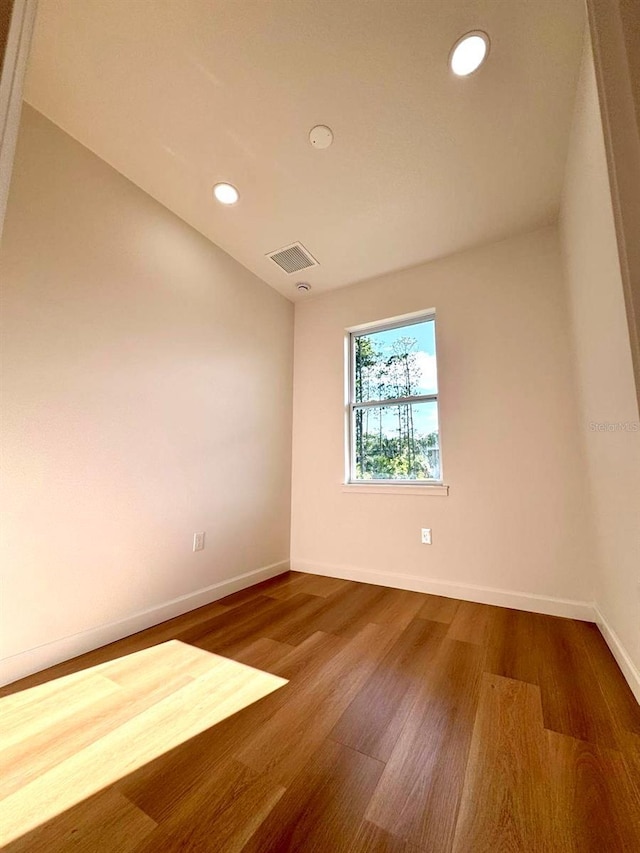 2634 De Groodt Rd SW, Palm Bay, FL 32908 - spare room with wood finished floors and recessed lighting