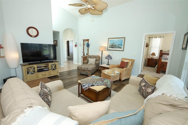 2362 Prairie Dunes, Clermont, FL 34711 - living area featuring a ceiling fan, wood finished floors, arched walkways, and high vaulted ceiling