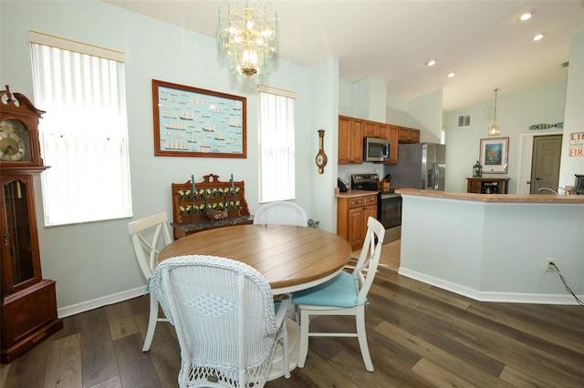 2362 Prairie Dunes, Clermont, FL 34711 - dining area featuring dark wood-type flooring, a chandelier, recessed lighting, and vaulted ceiling