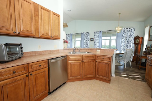 2362 Prairie Dunes, Clermont, FL 34711 - kitchen with dishwasher, lofted ceiling, brown cabinets, a peninsula, and light countertops