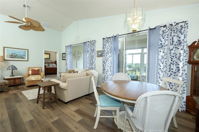 2362 Prairie Dunes, Clermont, FL 34711 - dining area with wood finished floors, a chandelier, ceiling fan, and high vaulted ceiling