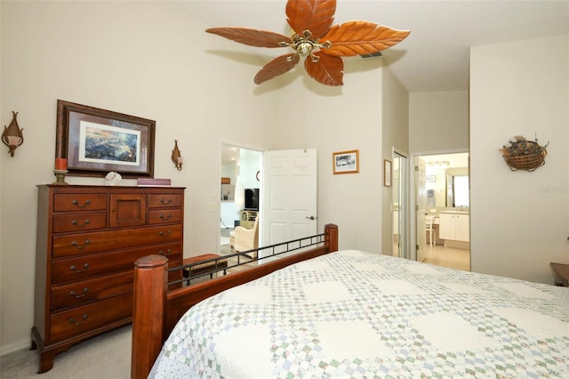 2362 Prairie Dunes, Clermont, FL 34711 - bedroom featuring ensuite bath, light carpet, and a ceiling fan