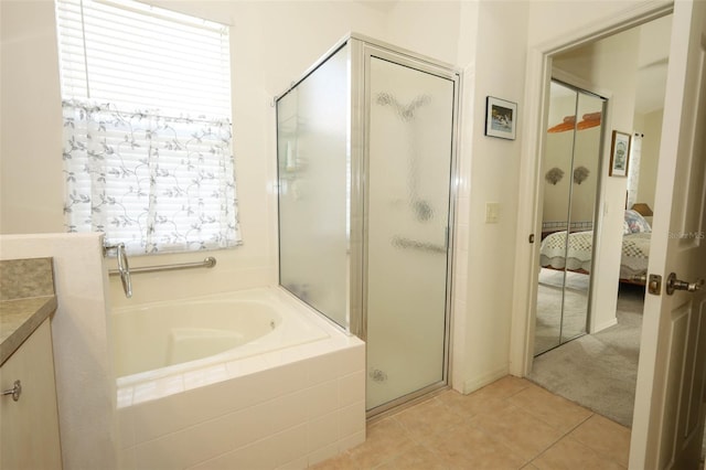 2362 Prairie Dunes, Clermont, FL 34711 - full bathroom featuring a stall shower, ensuite bath, a bath, tile patterned flooring, and vanity