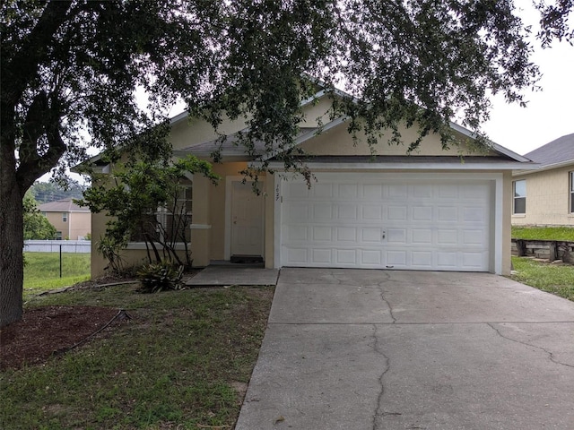 1027 Sheeler Hills Dr, Apopka, FL 32703 - view of front facade with stucco siding, concrete driveway, and a garage
