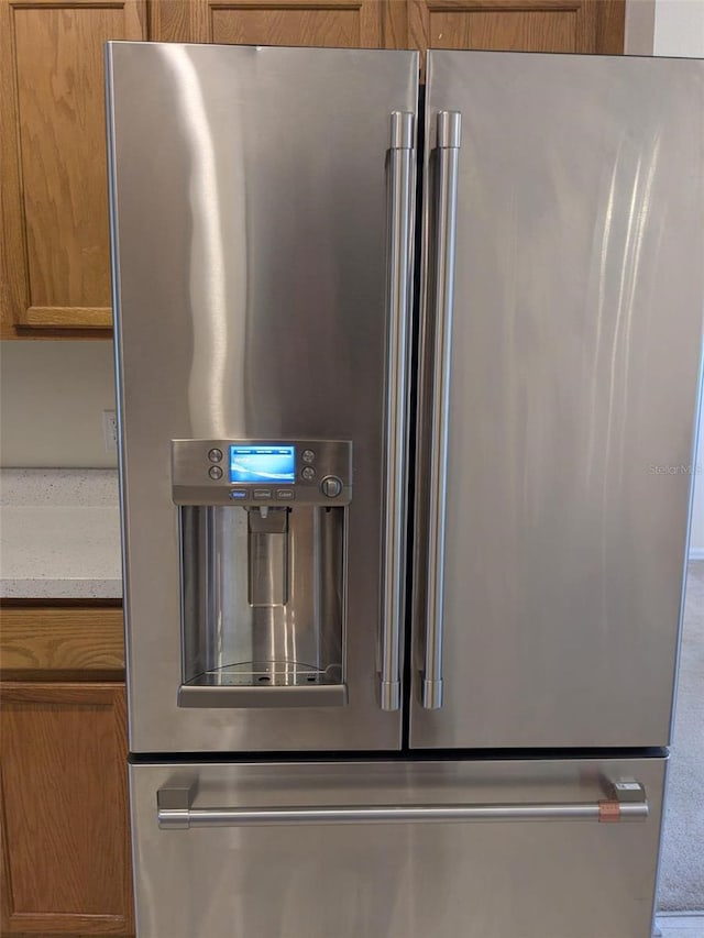 1027 Sheeler Hills Dr, Apopka, FL 32703 - kitchen view of high end fridge and brown cabinets
