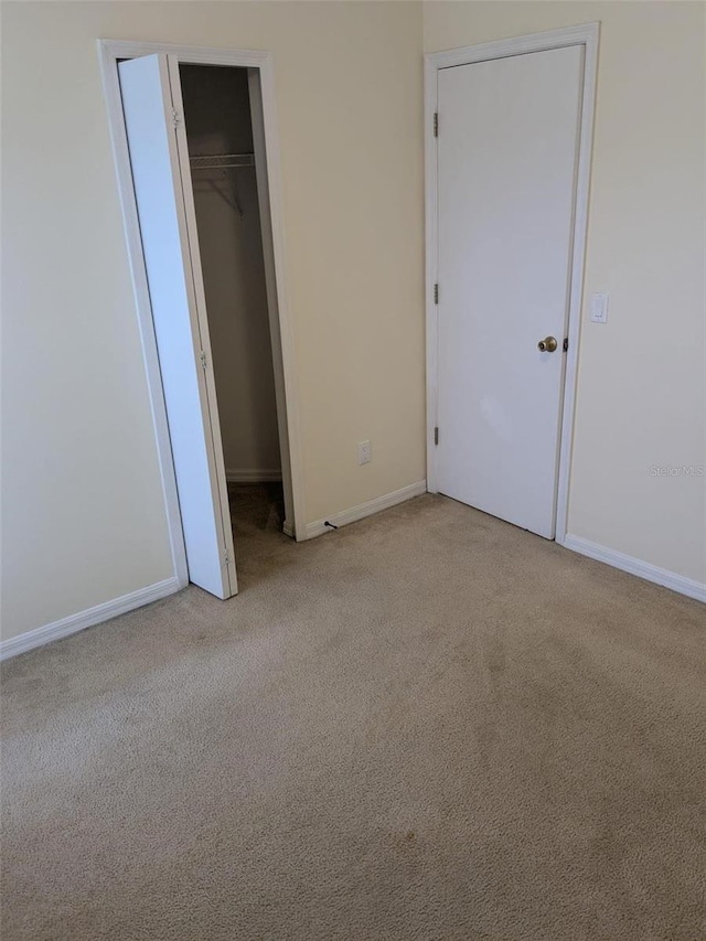 1027 Sheeler Hills Dr, Apopka, FL 32703 - unfurnished bedroom featuring light colored carpet and baseboards