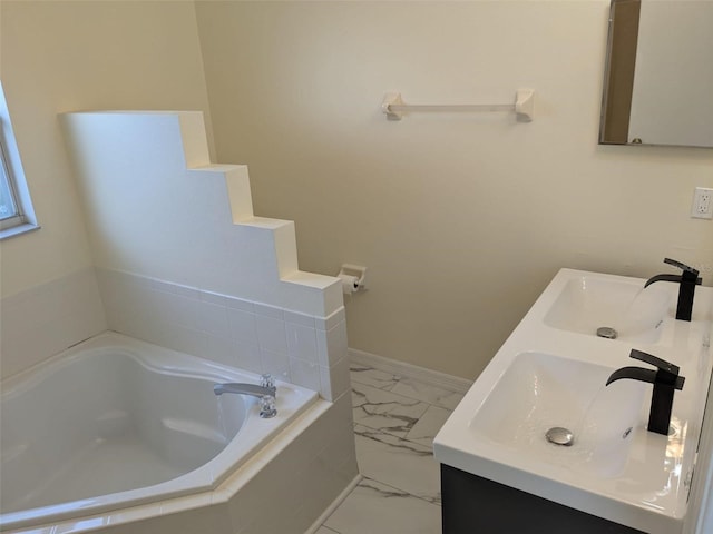 1027 Sheeler Hills Dr, Apopka, FL 32703 - bathroom with marble finish floors, double vanity, and a garden tub