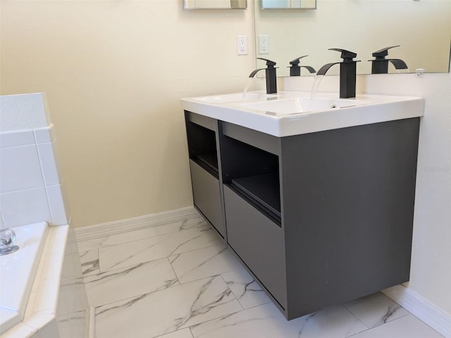 1027 Sheeler Hills Dr, Apopka, FL 32703 - bathroom with marble look tiles, double vanity, and a tub