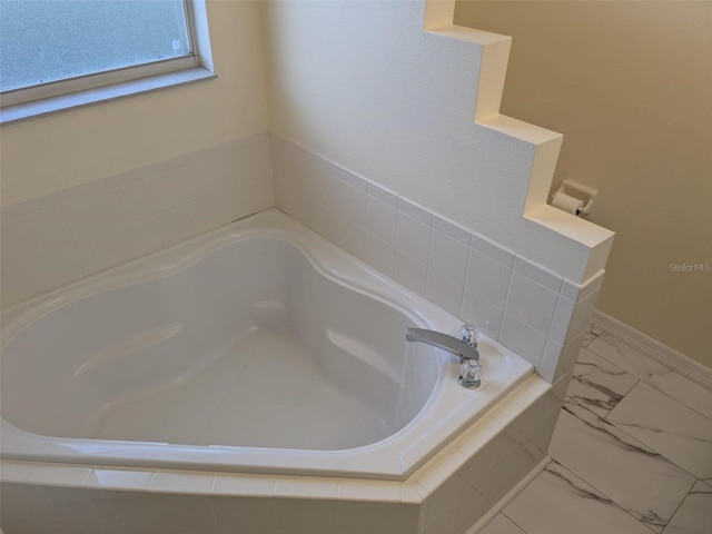 1027 Sheeler Hills Dr, Apopka, FL 32703 - full bath featuring a bath and marble look tile flooring