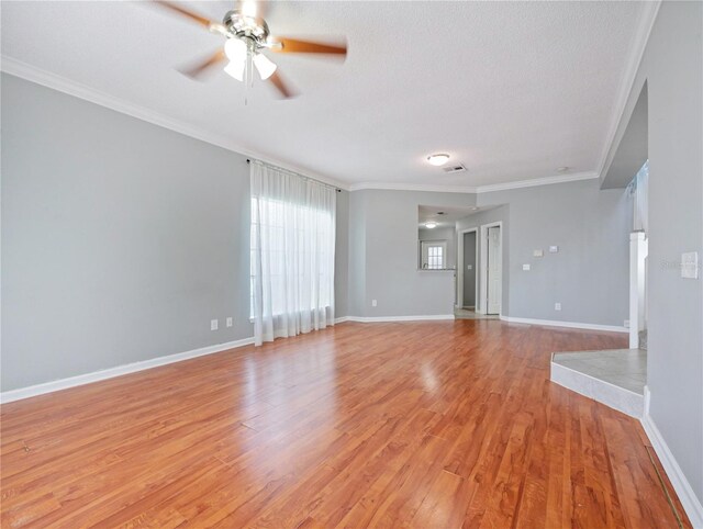 750 Olympic Cir Unit D1, Ocoee, FL 34761 - spare room with ceiling fan, ornamental molding, light wood finished floors, and a textured ceiling