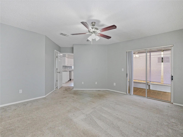 750 Olympic Cir Unit D1, Ocoee, FL 34761 - unfurnished living room featuring ceiling fan, light carpet, and a textured ceiling
