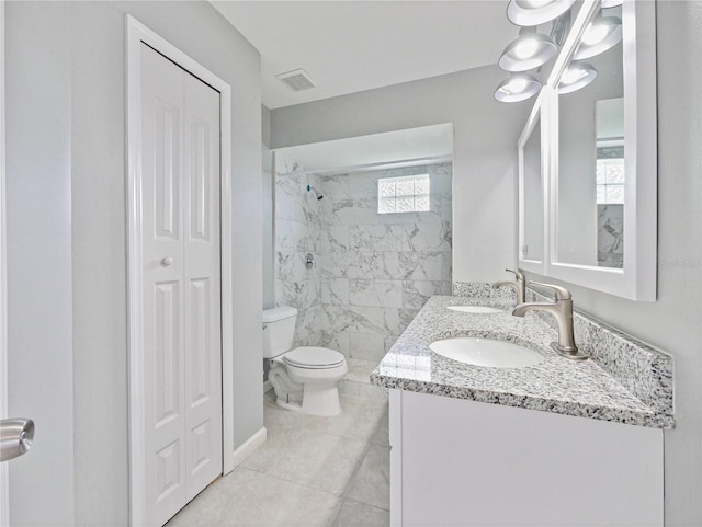 750 Olympic Cir Unit D1, Ocoee, FL 34761 - bathroom featuring a closet, double vanity, and a marble finish shower
