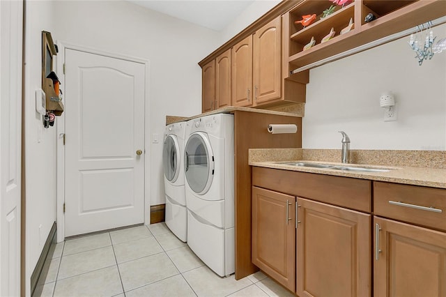 2388 Baronsmede Ct, Winter Garden, FL 34787 - laundry area featuring washer and dryer, cabinet space, and light tile patterned flooring