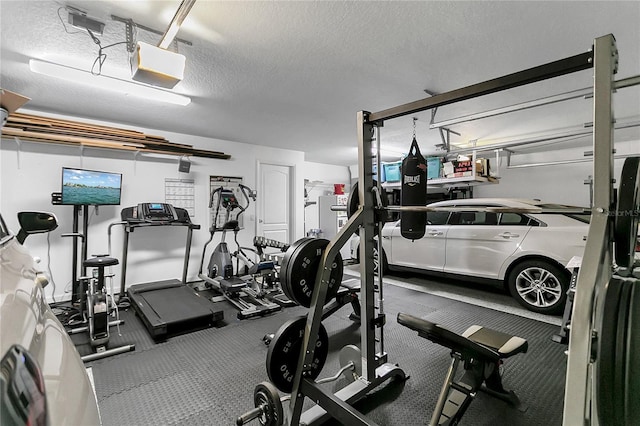 2388 Baronsmede Ct, Winter Garden, FL 34787 - gym featuring a garage and a textured ceiling