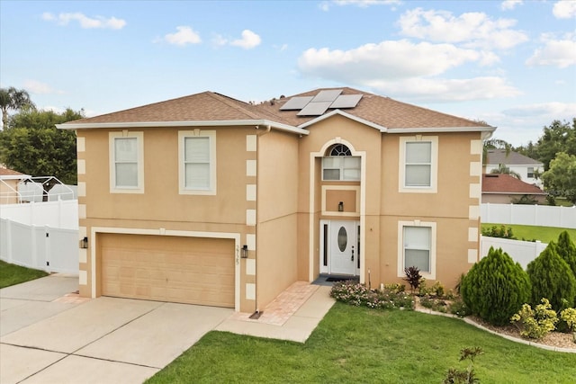 2725 White Magnolia Loop, Clermont, FL 34711 - view of front of house featuring stucco siding, solar panels, an attached garage, concrete driveway, and a shingled roof
