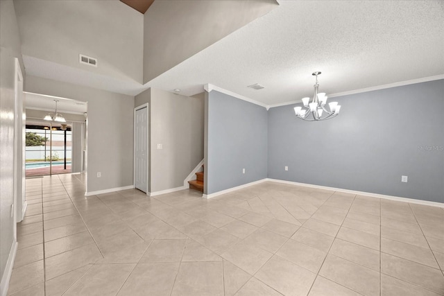2725 White Magnolia Loop, Clermont, FL 34711 - unfurnished room with a chandelier, light tile patterned flooring, stairway, crown molding, and a textured ceiling