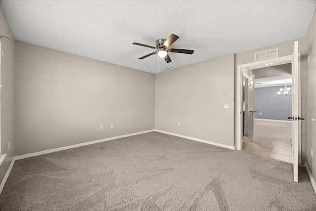 2725 White Magnolia Loop, Clermont, FL 34711 - unfurnished bedroom featuring carpet, a ceiling fan, a textured ceiling, a chandelier, and tile patterned flooring