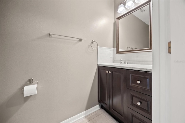 2725 White Magnolia Loop, Clermont, FL 34711 - bathroom with vanity and tasteful backsplash