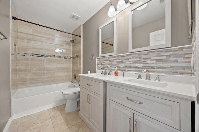 2725 White Magnolia Loop, Clermont, FL 34711 - full bath featuring double vanity, washtub / shower combination, tile patterned flooring, and backsplash