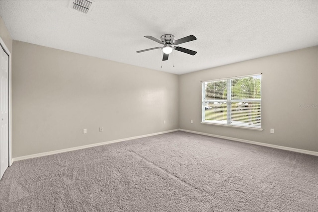 2725 White Magnolia Loop, Clermont, FL 34711 - carpeted empty room featuring a ceiling fan and a textured ceiling