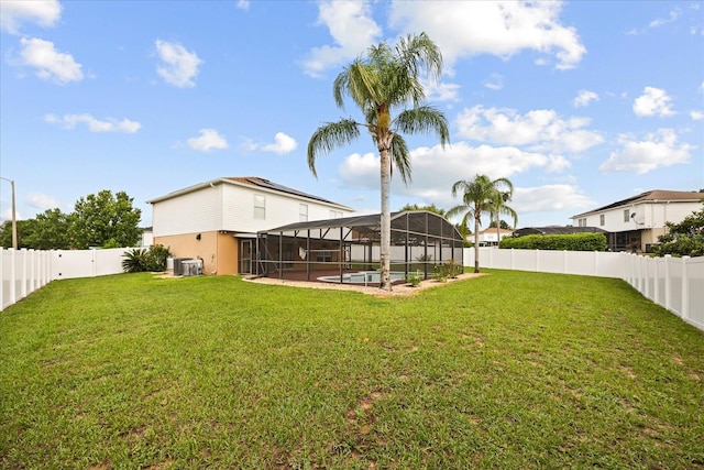 2725 White Magnolia Loop, Clermont, FL 34711 - fenced backyard with glass enclosure, a pool, and a patio
